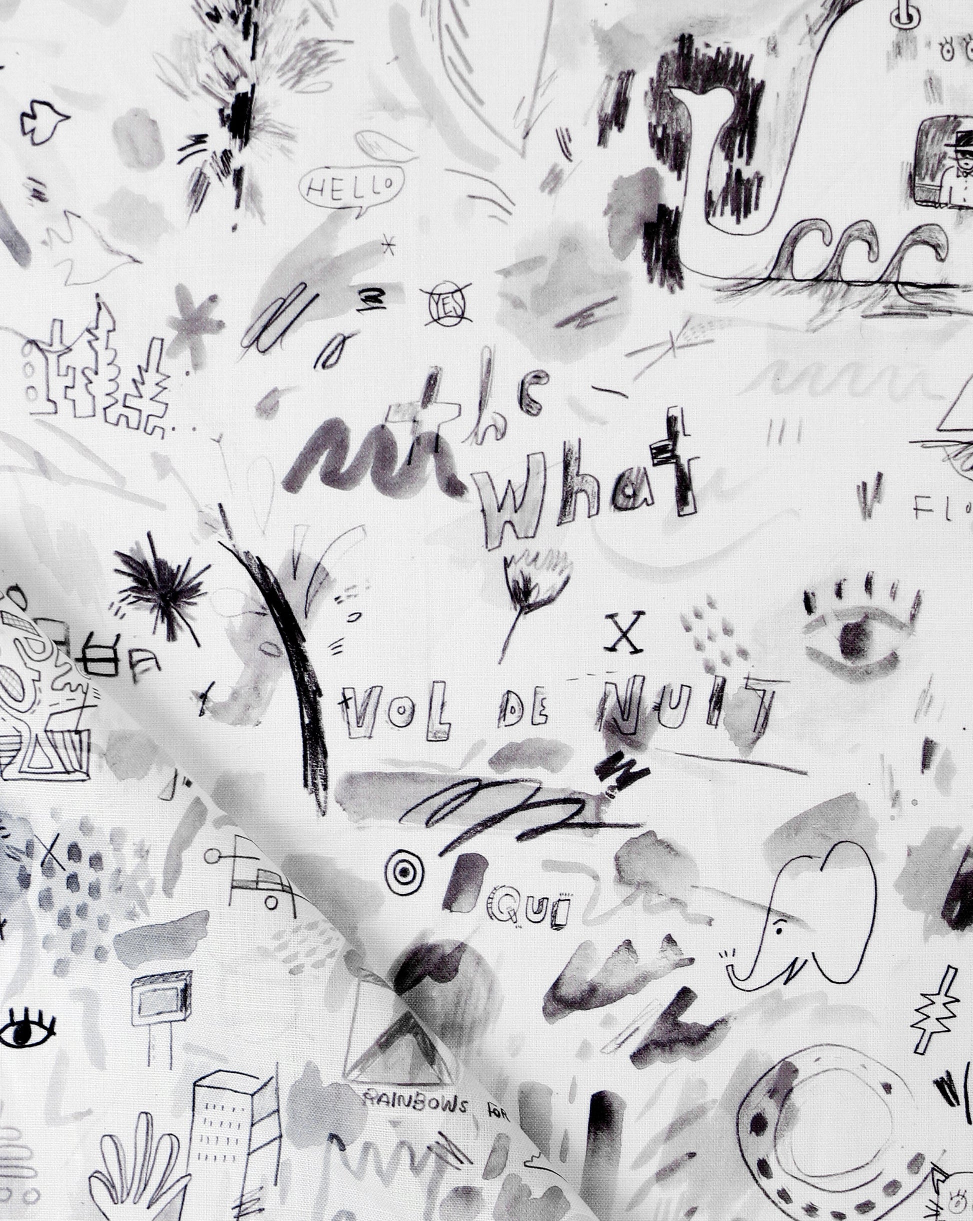 A black and white luxury Vol de Nuit Fabric Noire with a lot of writing on it, such as Eskayel and Vol de Nuit designs