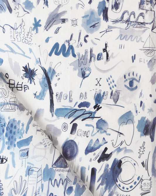 A blue and white Vol de Nuit Fabric with a lot of writing on it.