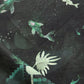 A Water Signs Fabric Emerald, a water-themed piece of high-end fabric with fish and plants on it