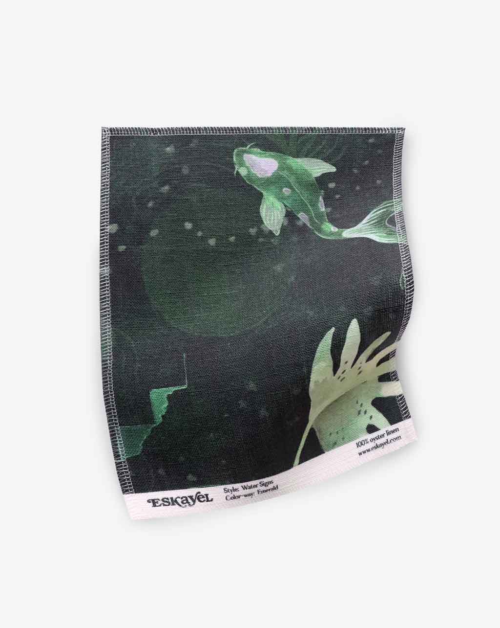 A Water Signs Fabric Emerald hand fabric with an image of a koi fish