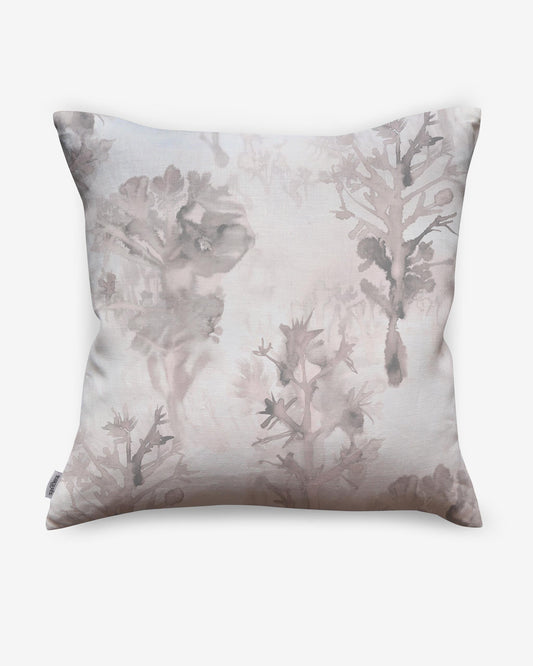 A luxury Aionas Pillow with a pink and white tree print