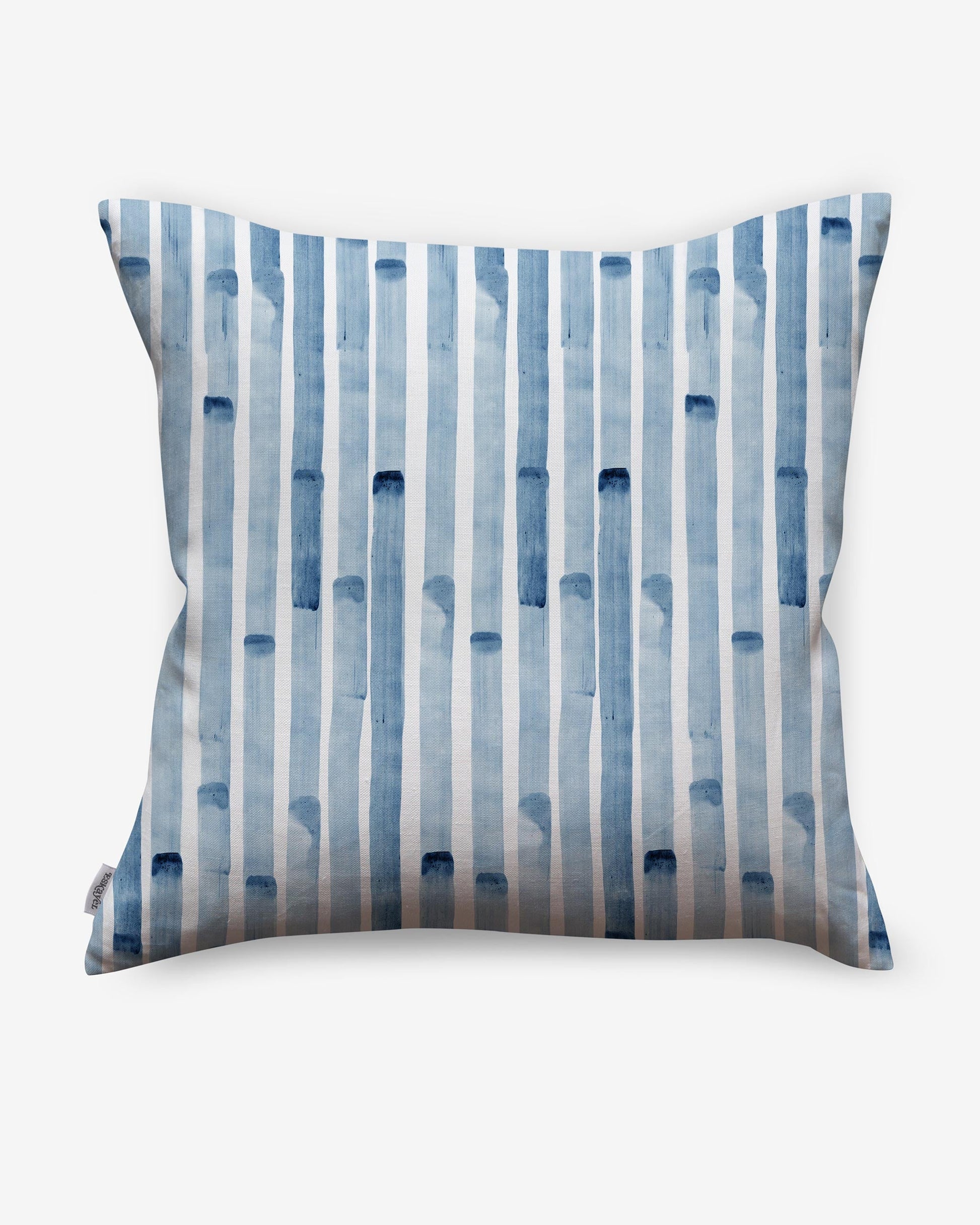 A Bamboo Stripe Pillow Azure with blue and white stripes in a watercolor style on it