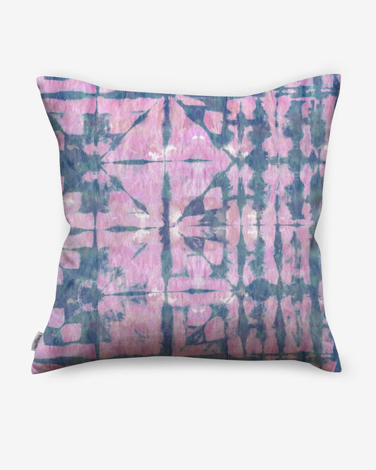 A Banda Pillow Pinken with a shibori tie-dye design