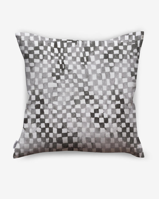 A Chess Pillow Grey with a black and white checkerboard pattern is made with luxury fabric