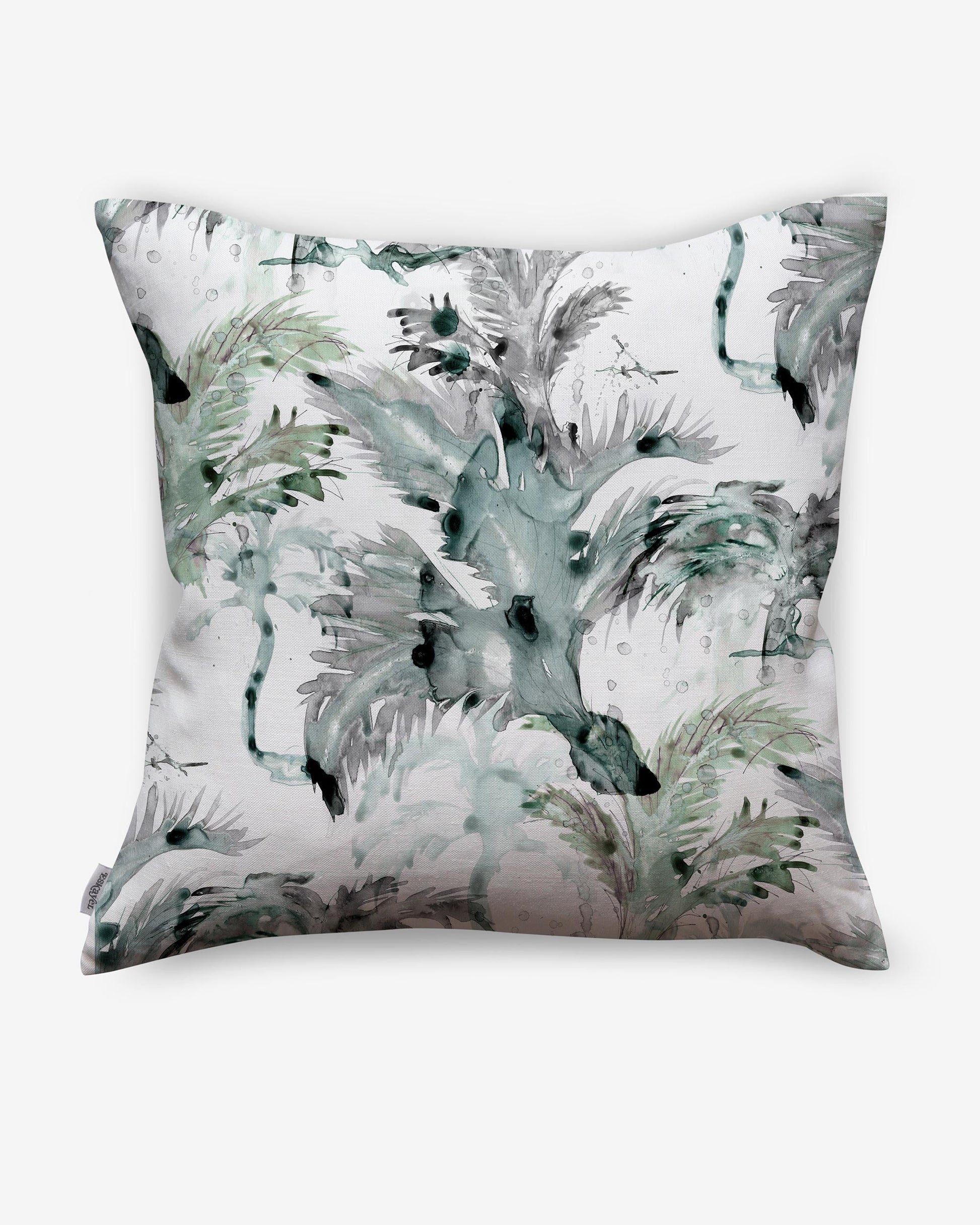 A Cocos Pillow with palm tree motifs on it