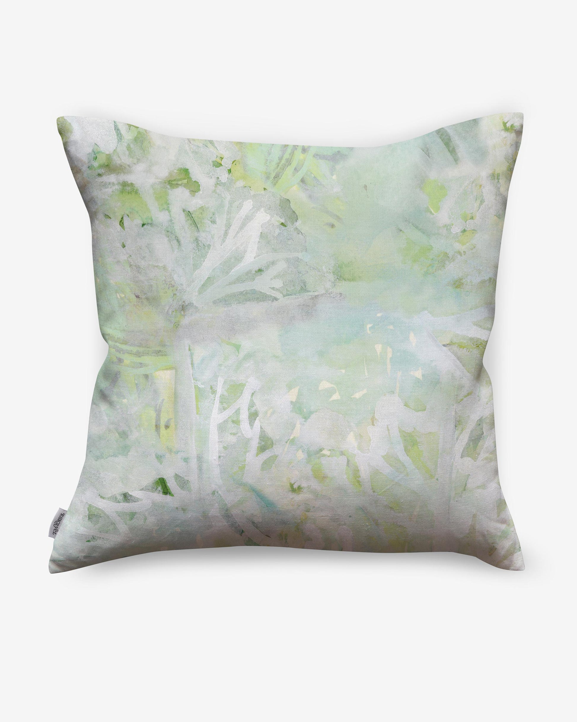 A Cortile Pillow with a soft watercolor pattern on it