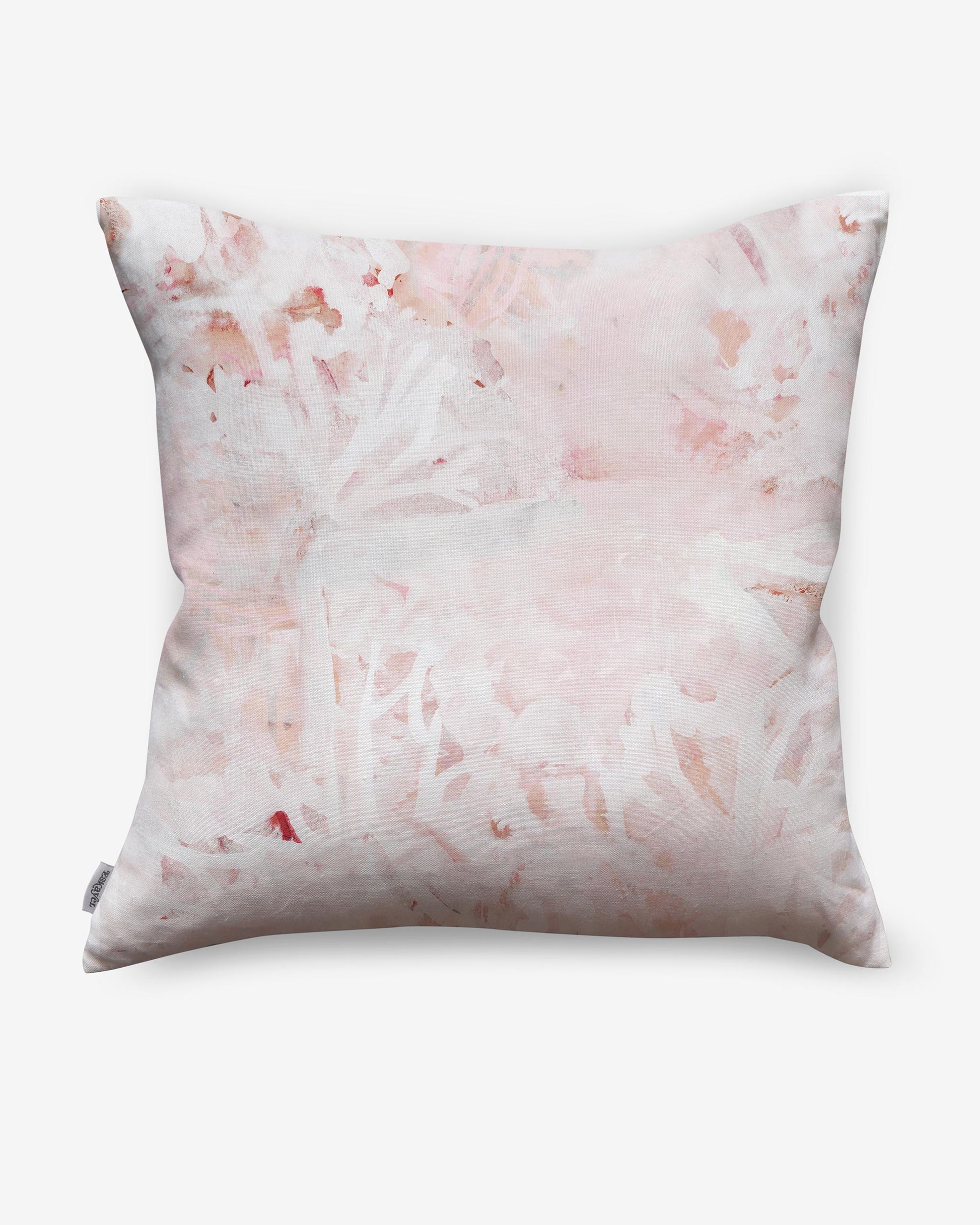 A pink and white Cortile Pillow Pelle with a floral pattern