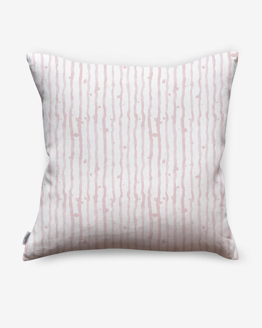 A Drippy Stripe Pillow Coral with a nautical pattern in pink and white stripes