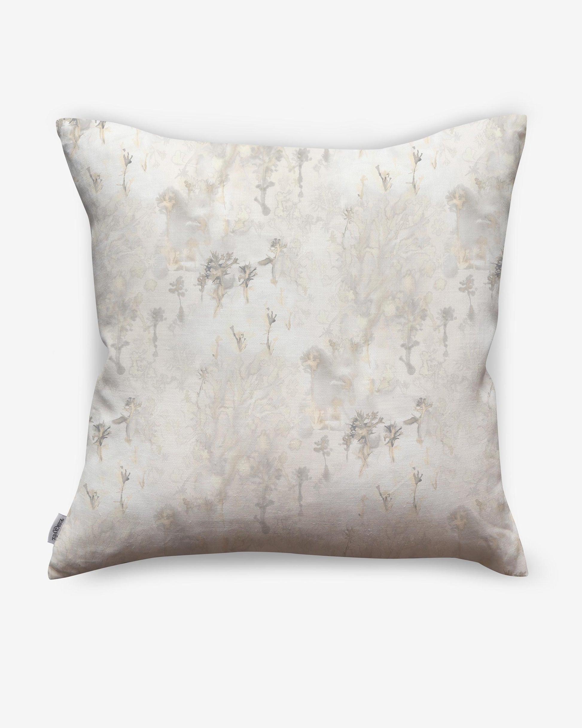 A white and beige Emvasia Pillow with a floral pattern