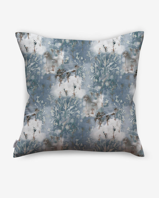A luxury Emvasia Pillow with a blue and white floral pattern