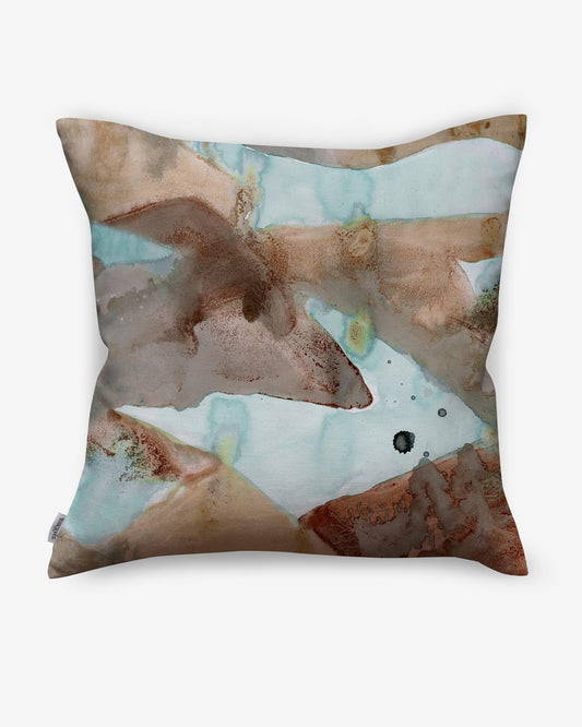 A Mani Pillow with a watercolor painting in Mani colorway.