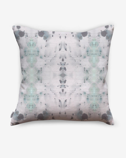 A luxurious Nairutya Pillow from the Jangala Collection with a grey and white pattern on it