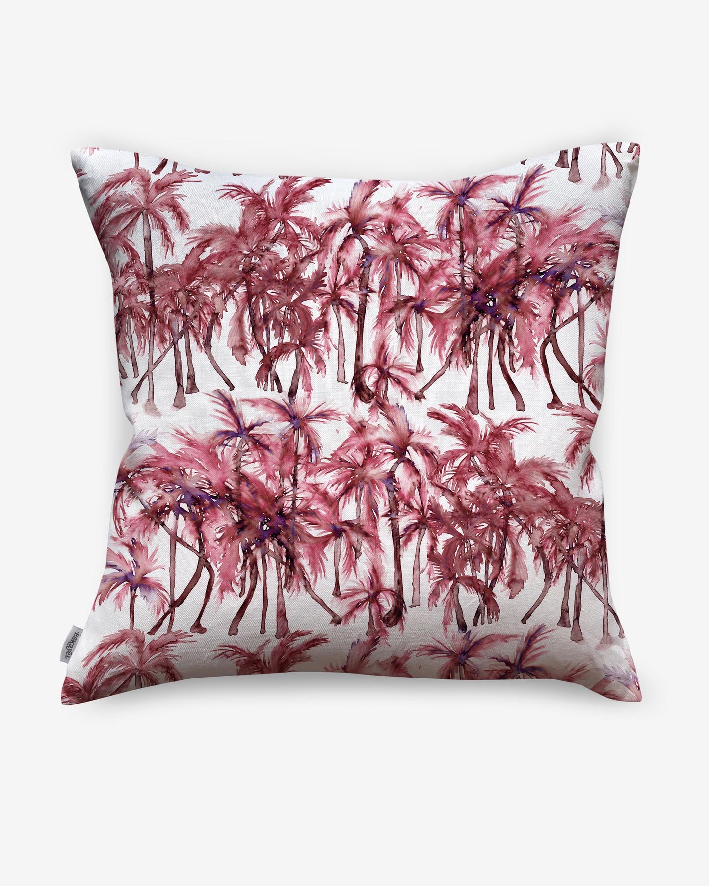 A pink and white luxury fabric Palm Dance Pillow Persimmon with a Palm Dance pattern on it