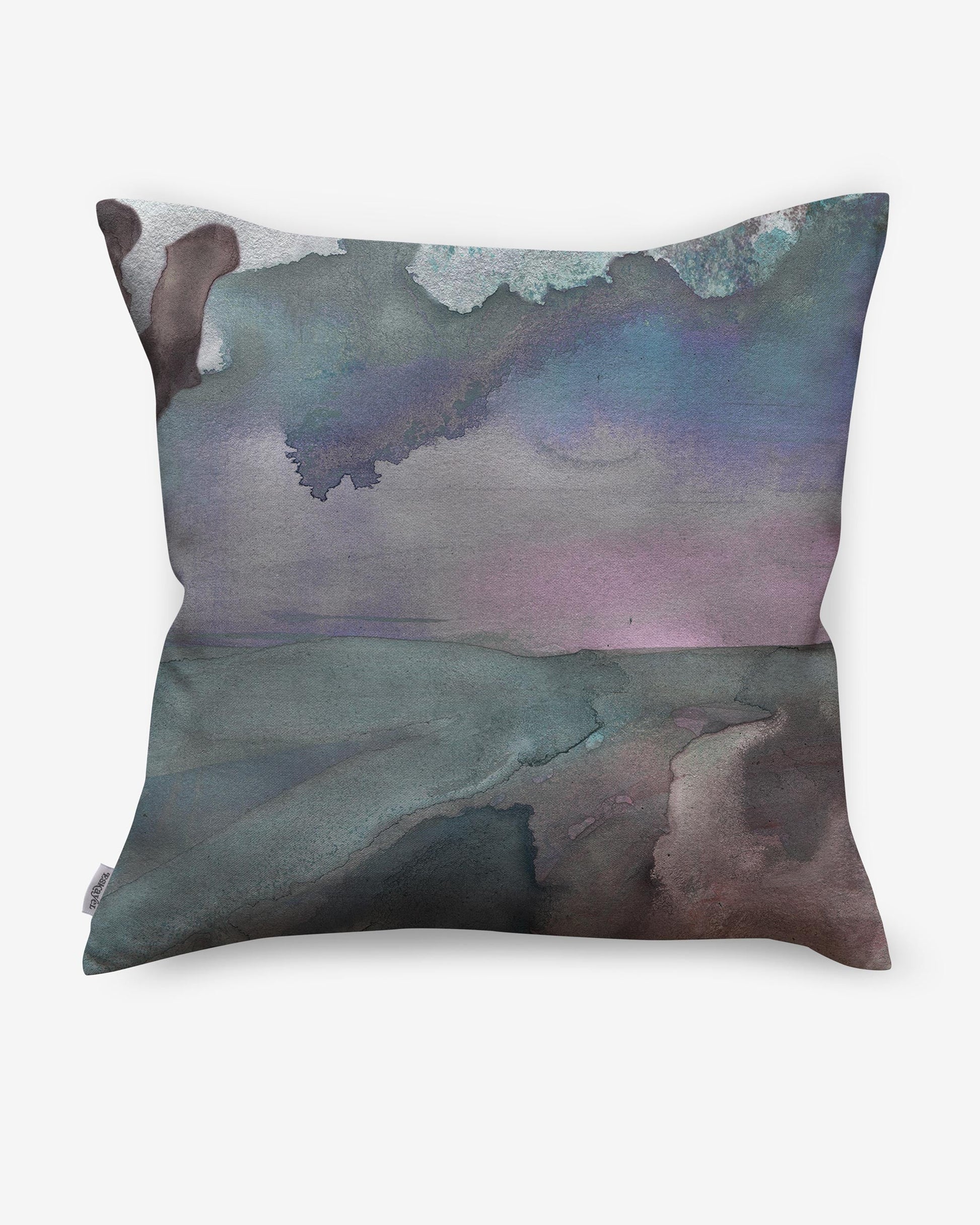 A Palmeraie Pillow with a watercolor painting of the ocean