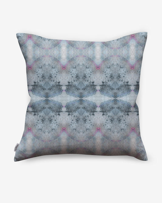 A Parvati Pillow Cerulean with a blue and pink abstract design from Eskayel's Dea Collection