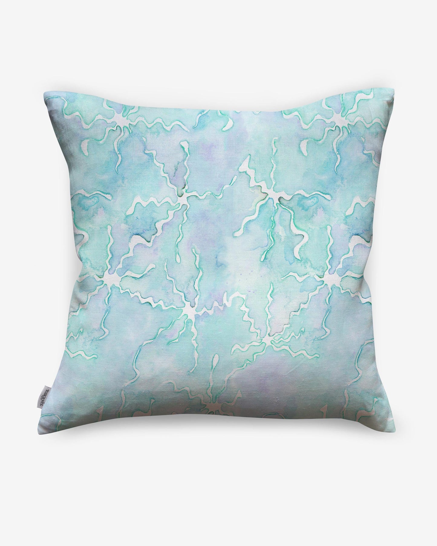A high-end Pecosa Pillow design with a blue and white pattern, incorporating sun motifs and resist dye techniques