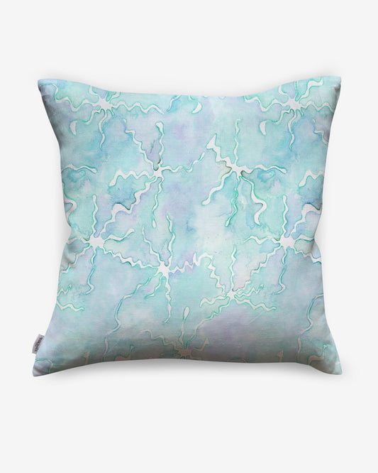 A high-end Pecosa Pillow design with a blue and white pattern, incorporating sun motifs and resist dye techniques.