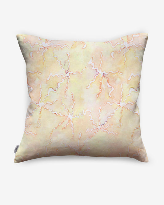 A high-end Pecosa Pillow design with a pink and yellow abstract design incorporating sun motifs