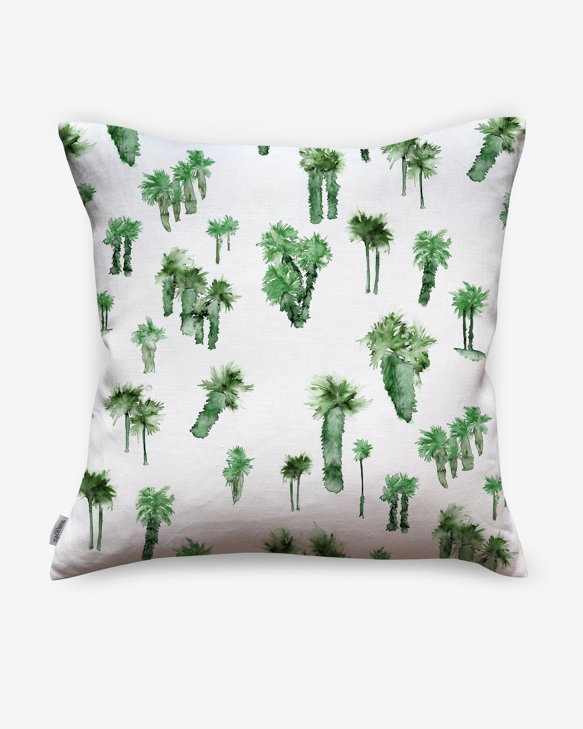 A Perfect Palm Pillow featuring a watercolor-style palm tree design