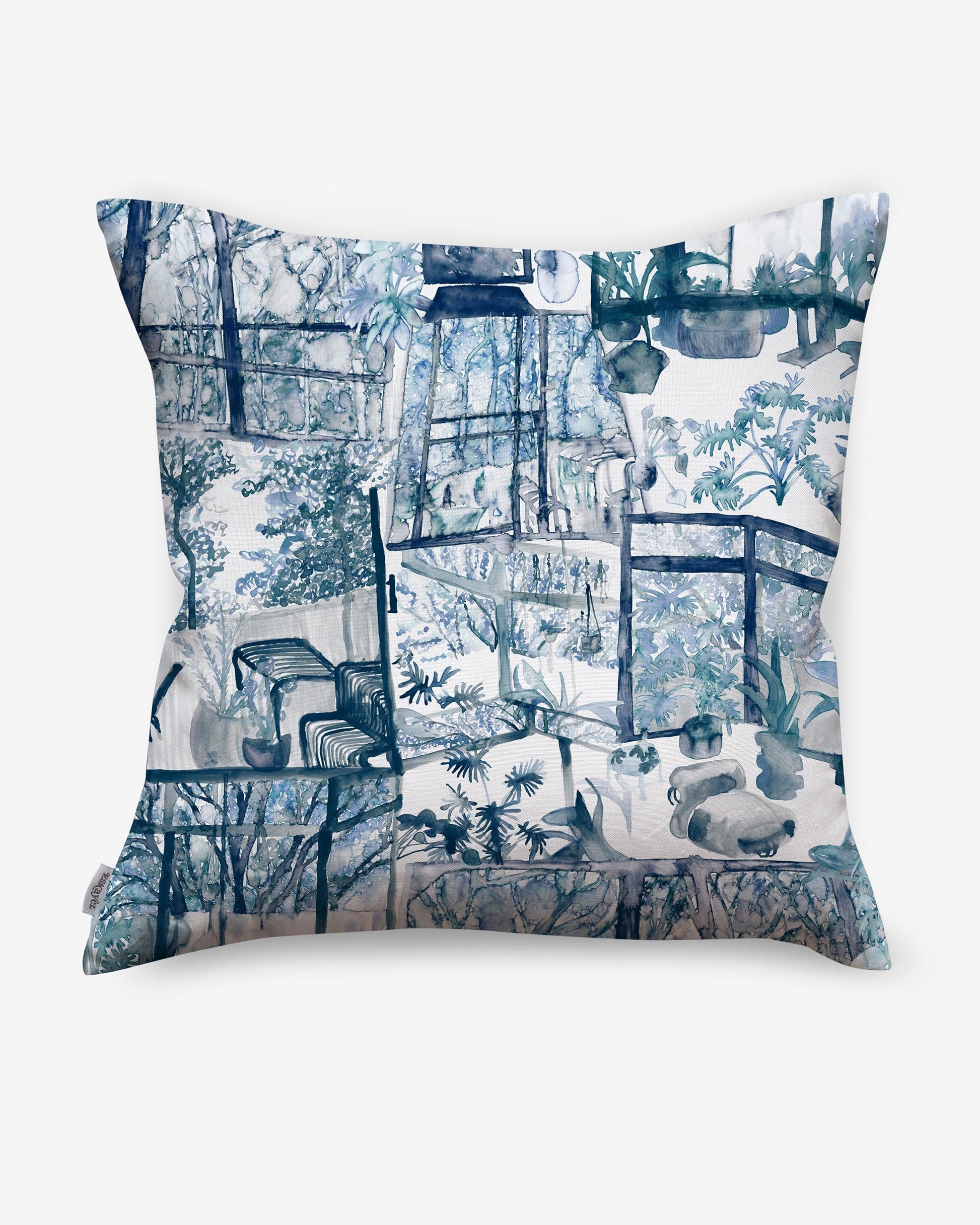A blue and white Quotidiana Pillow Midnight, featuring images of trees and flowers
