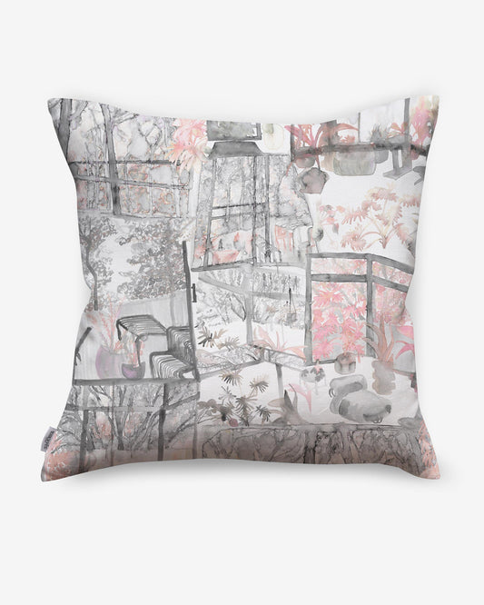 A Quotidiana Pillow||Pink Island with a pink painting on it.