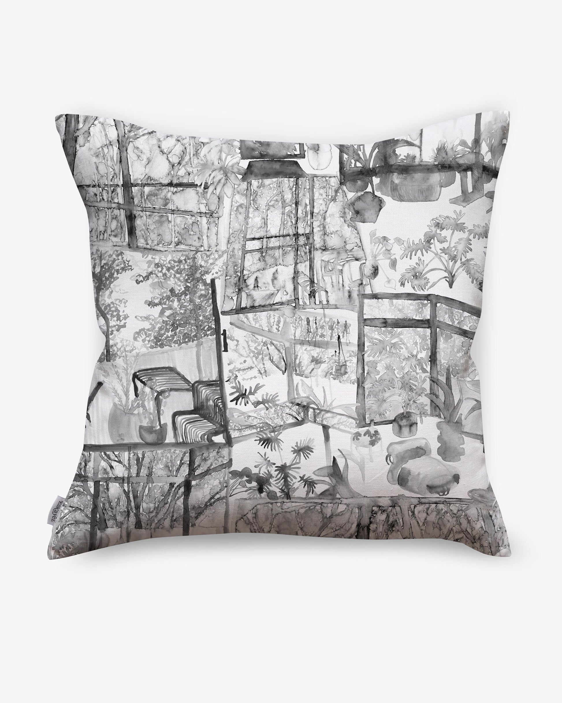 A Quotidiana Pillow in slate colorway with pictures on it