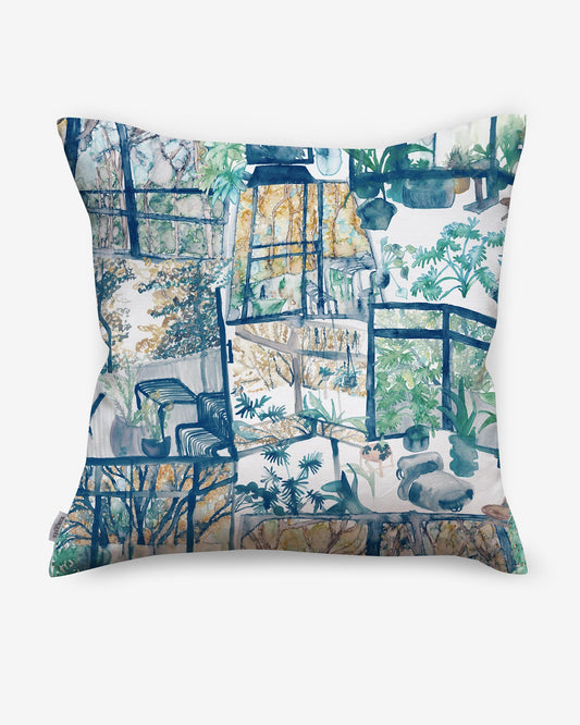 A blue and white Quotidiana Pillow||Twilight with an image of a window made from high-end fabric, featuring the Quotidiana pattern.
