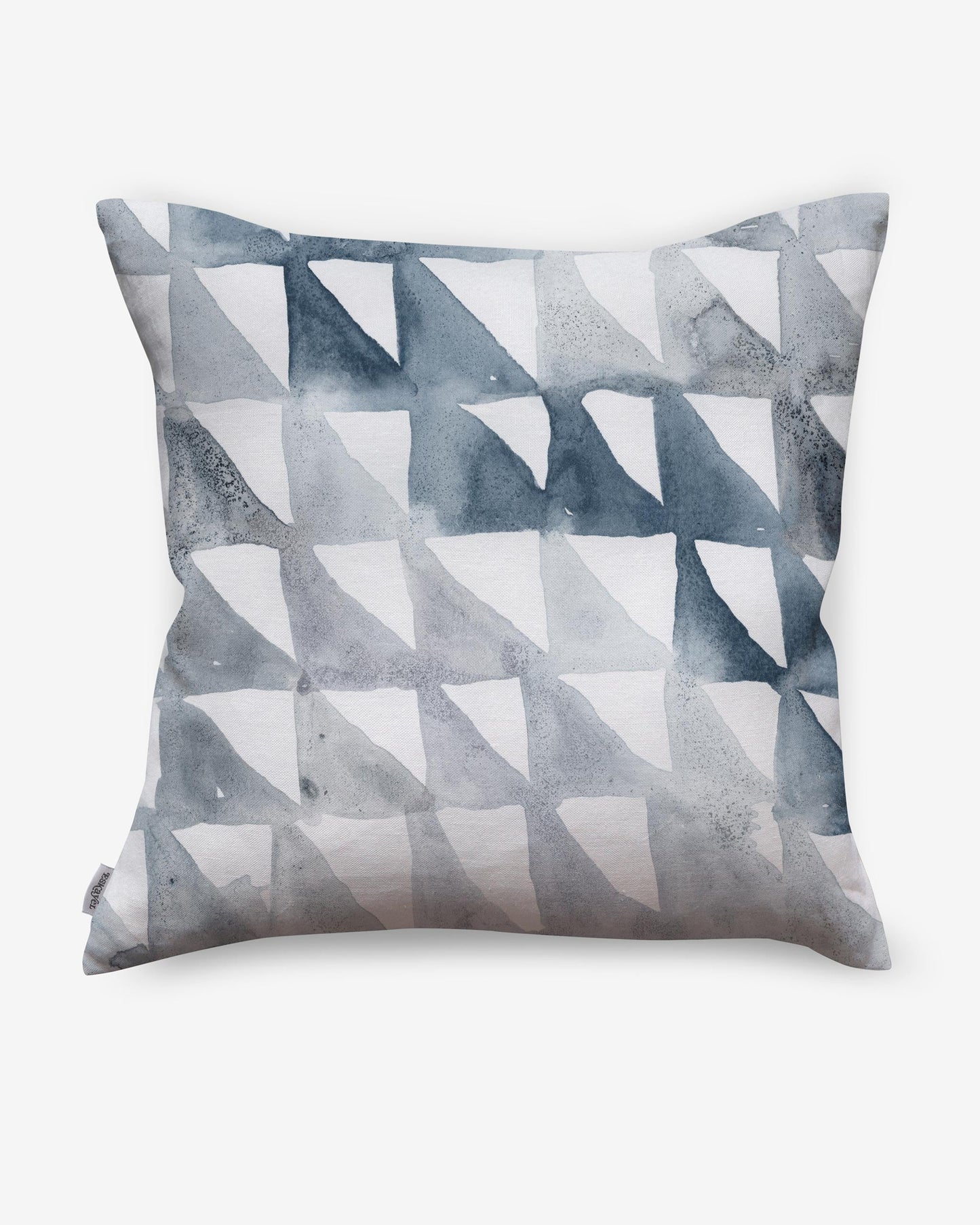 A Triangle Checks Pillow Ocean with blue and white triangles, part of a geometric sequence, on it