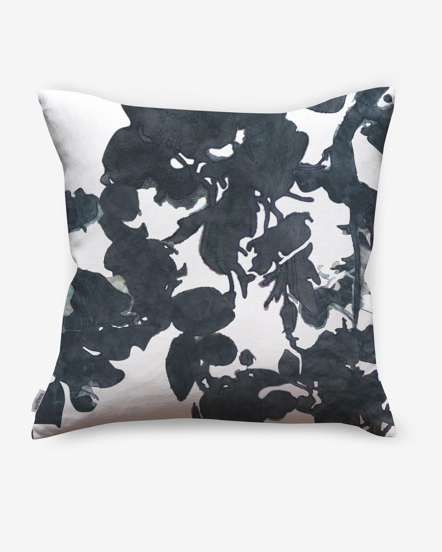 An Up For Anything Pillow with an abstract botanical pattern