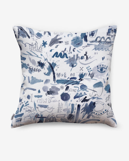 A luxury fabric Vol de Nuit Pillow with a blue and white Eskayel design on it.