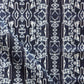 A fabric with the Akimbo Performance Fabric Indigo Ikat pattern