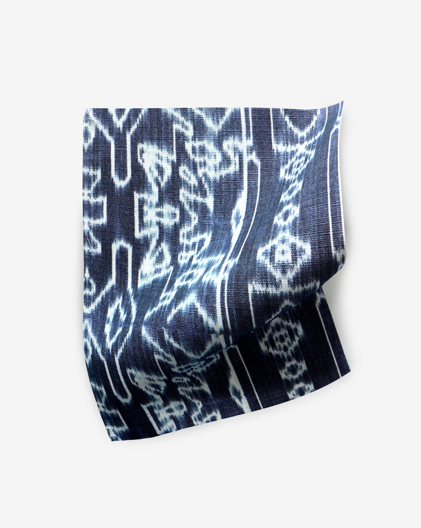 A fabric with the Akimbo Performance Fabric Indigo Ikat pattern