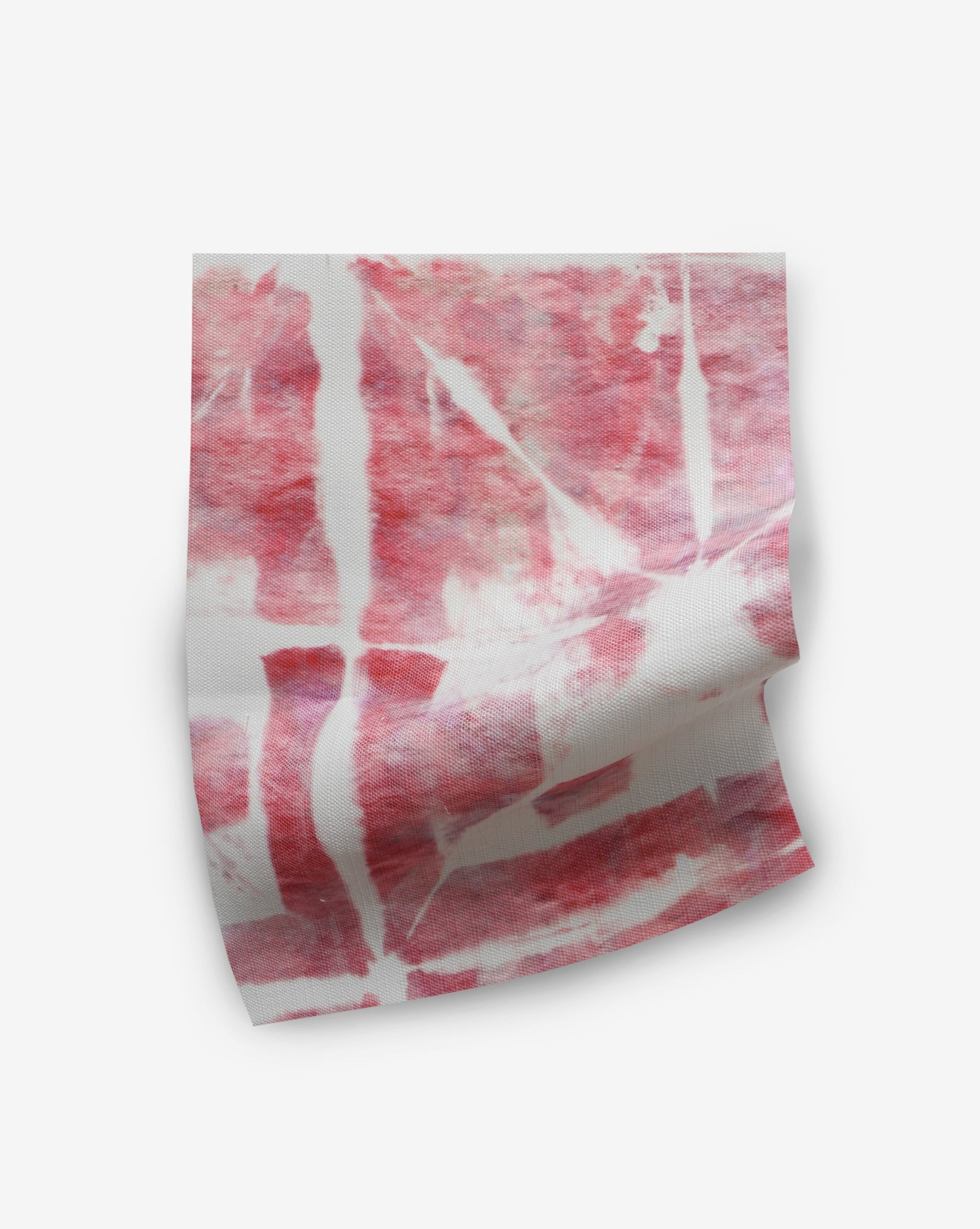 A piece of Banda Performance Fabric Persimmon with red and white stripes on it