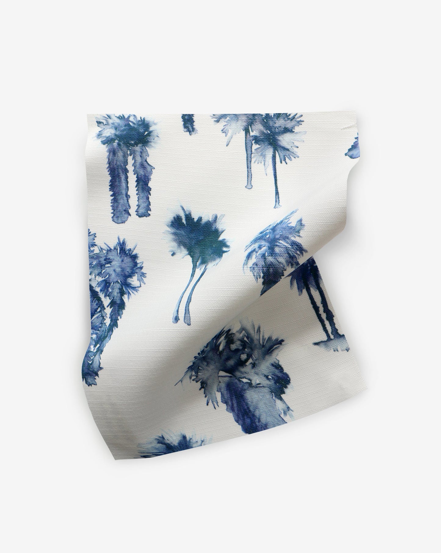 A blue and white Perfect Palm Performance Fabric with a hint of Midnight on it.
