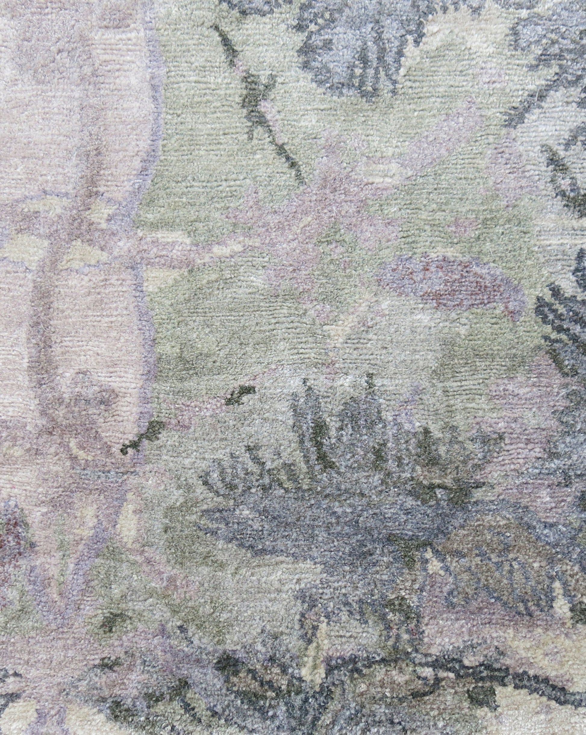 An image of a Laurel Forest Hand Knotted Rug Dove, with a tree on it, creating a tropical atmosphere