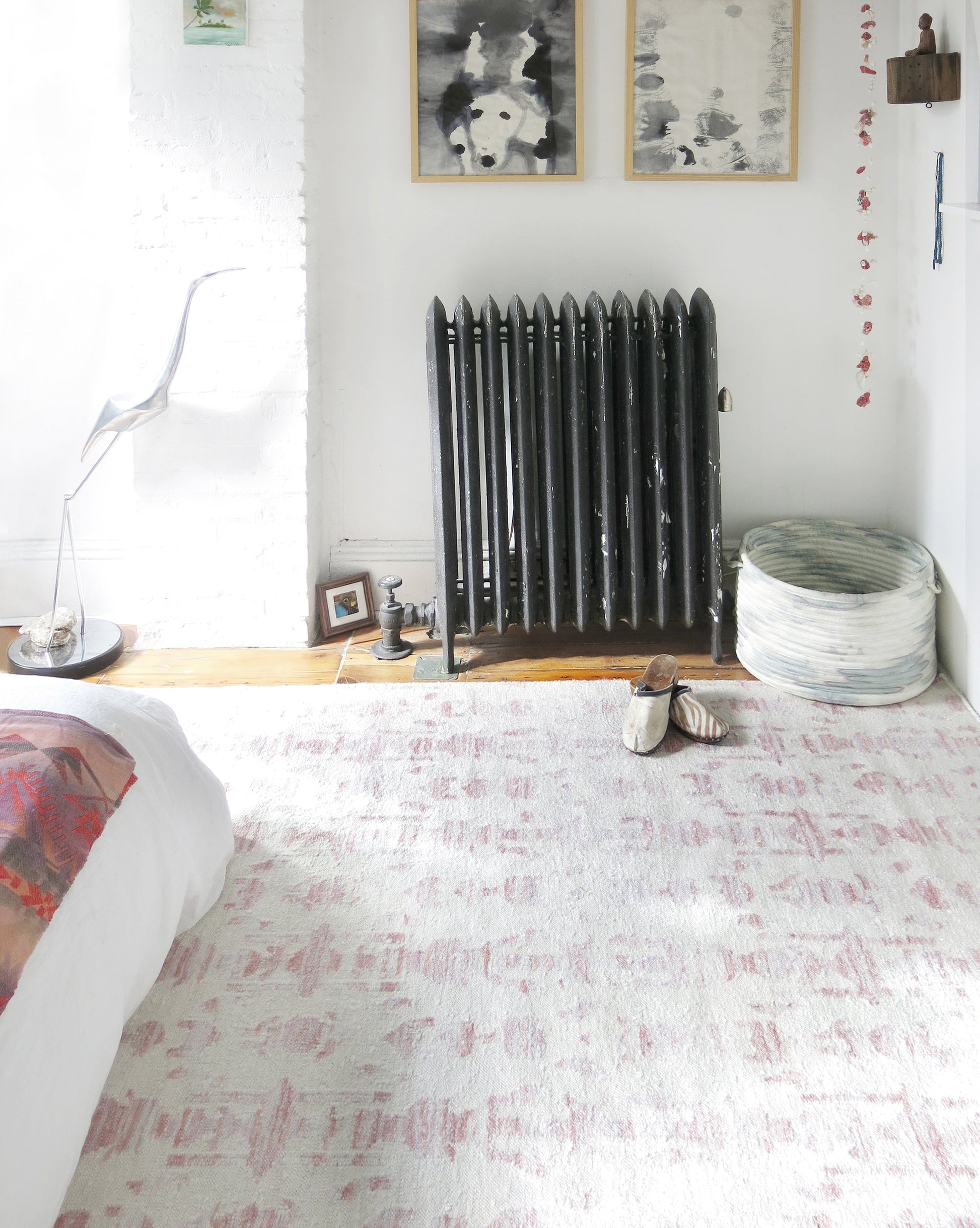 A white bedroom with a Biami Flatweave Rug