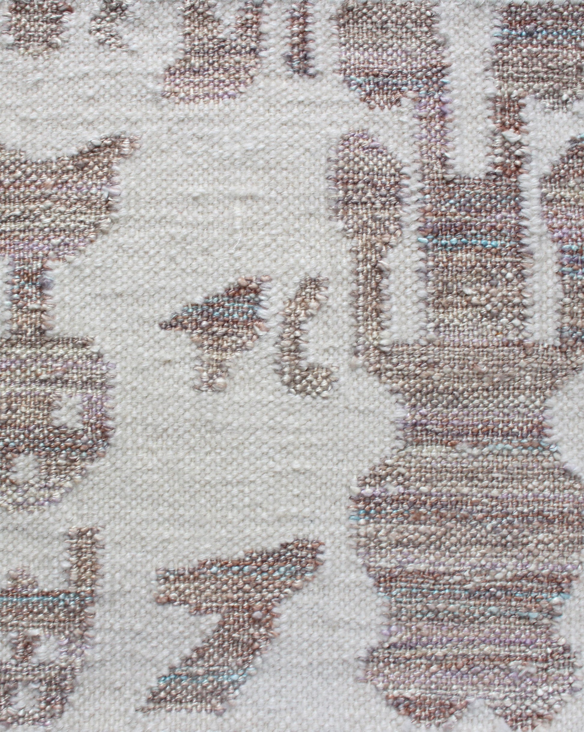 A close up of a Biami Flatweave Rug Hide with a bird on it