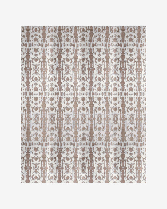 A brown and white pattern on a Biami Flatweave Rug||Hide in the Biami colorway.