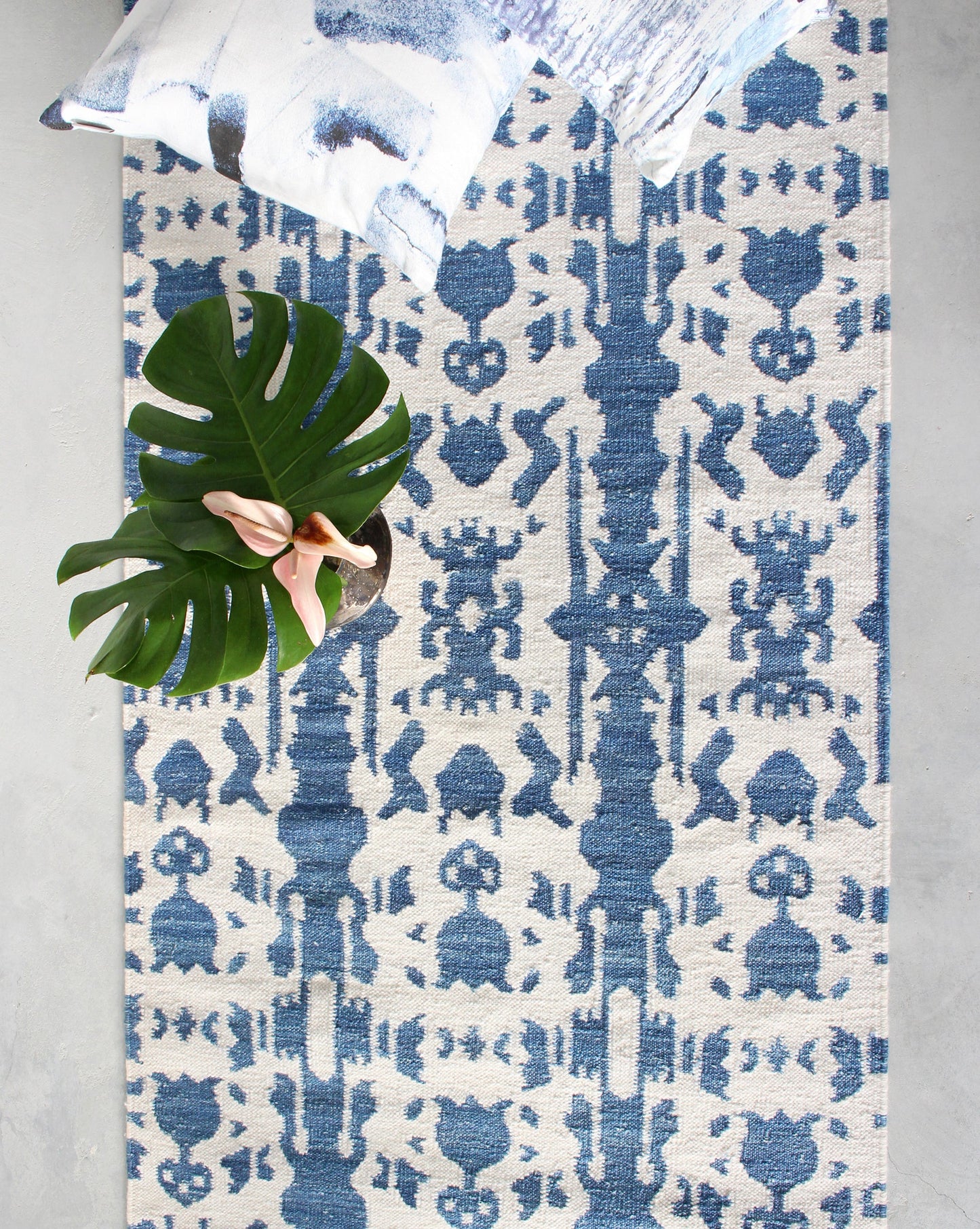 A blue and white Biami flatweave rug in Indigo color