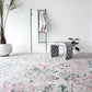 A white room with a Bosky Toile Hand Knotted Rug Spectra and a plant on it