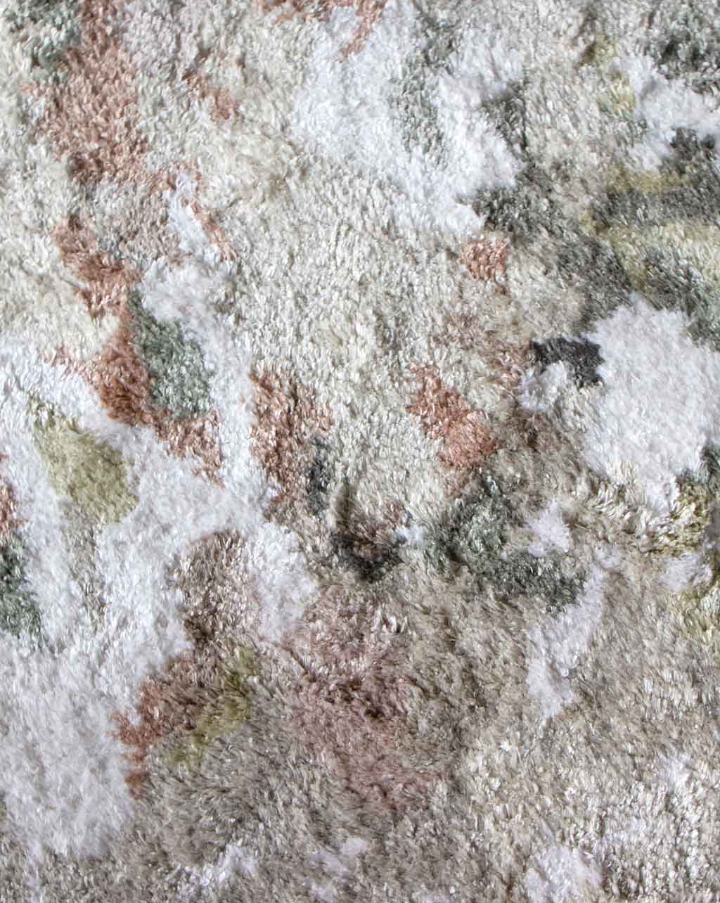 A close up of a Cortile Hand Knotted Rug Alba with a lot of different colors and patterns