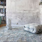 A room with a Kotoubia Hand Knotted Rug and bookshelves
