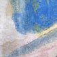A painting with an abstract design and a Lilys View Hand Knotted Rug Dawn background