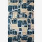 A blue and beige Quotidiana Hand Knotted Rug Corinth with abstract rug design on it