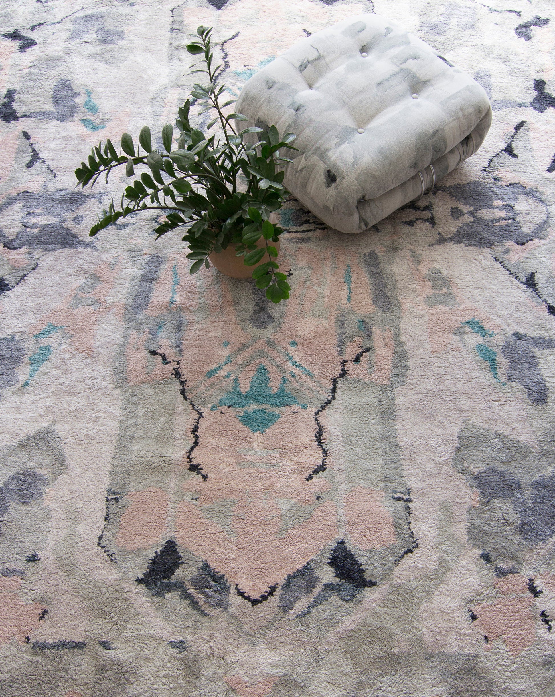 A Tamandot Hand Knotted Rug Duomo with a symmetrical abstract pattern on it
