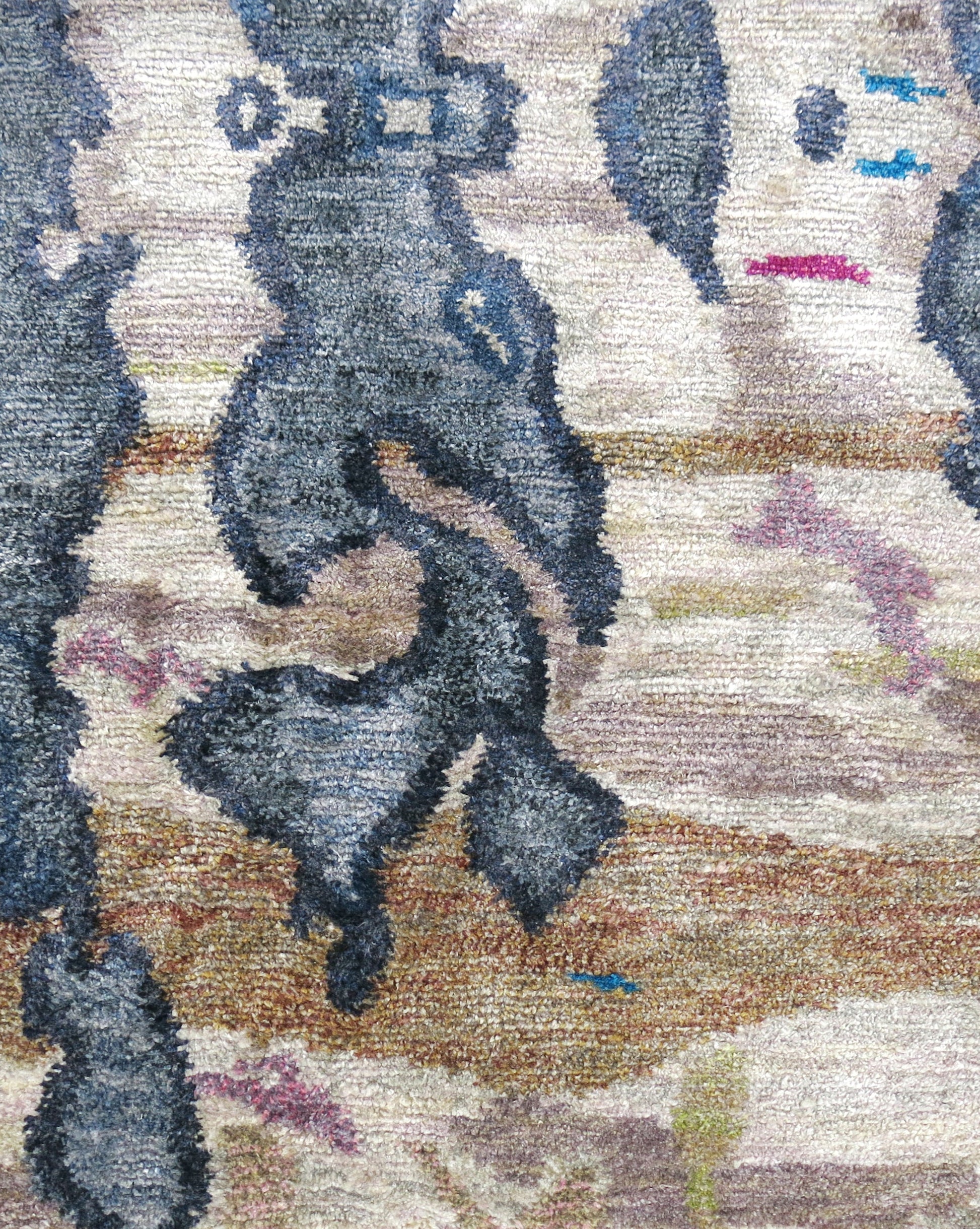 A close up image of a modern rug from The Dance Hand Knotted Rug Olive
