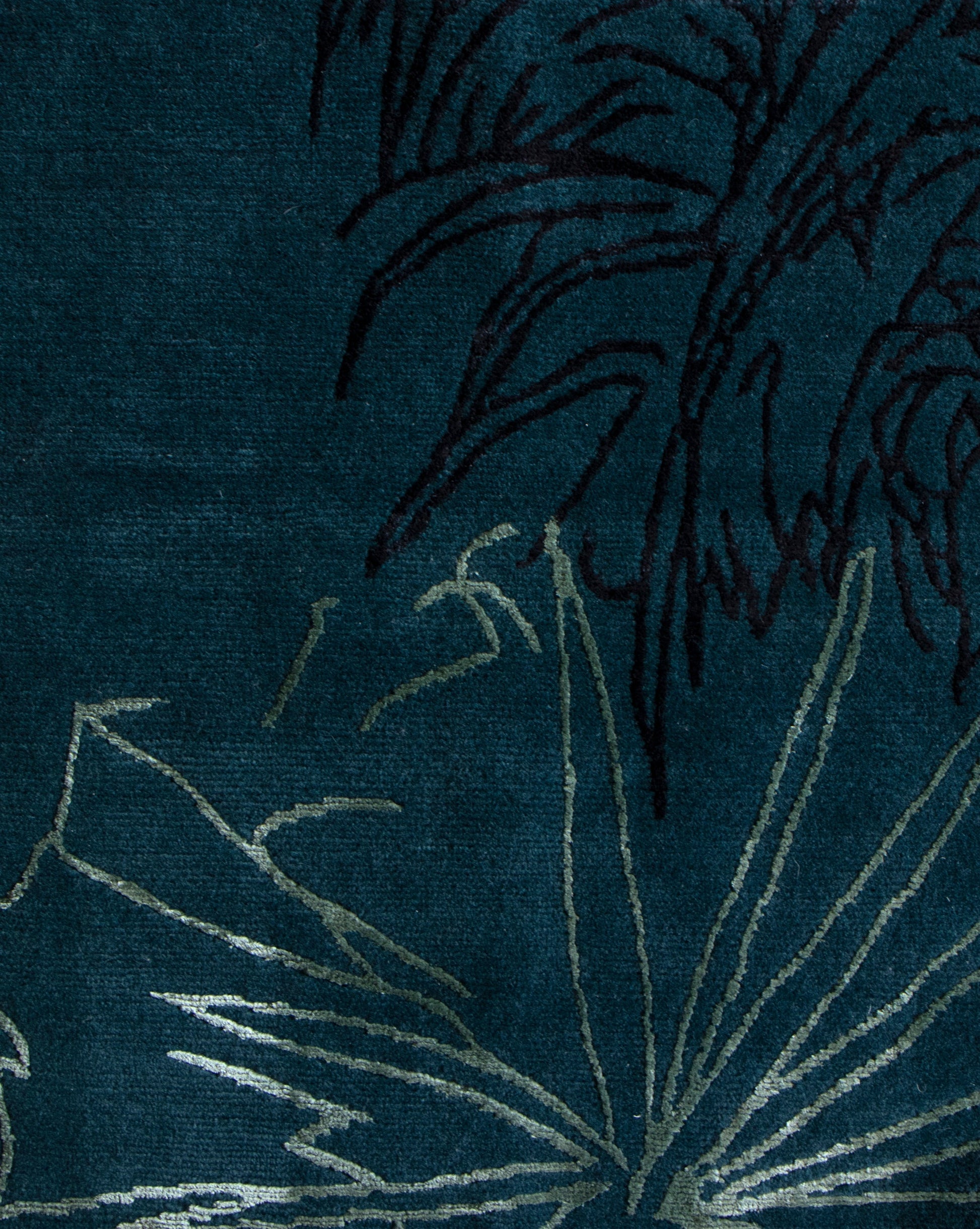 A botanical drawing of a palm tree on a blue background from the Through The Grove Hand Knotted Rug   Azure