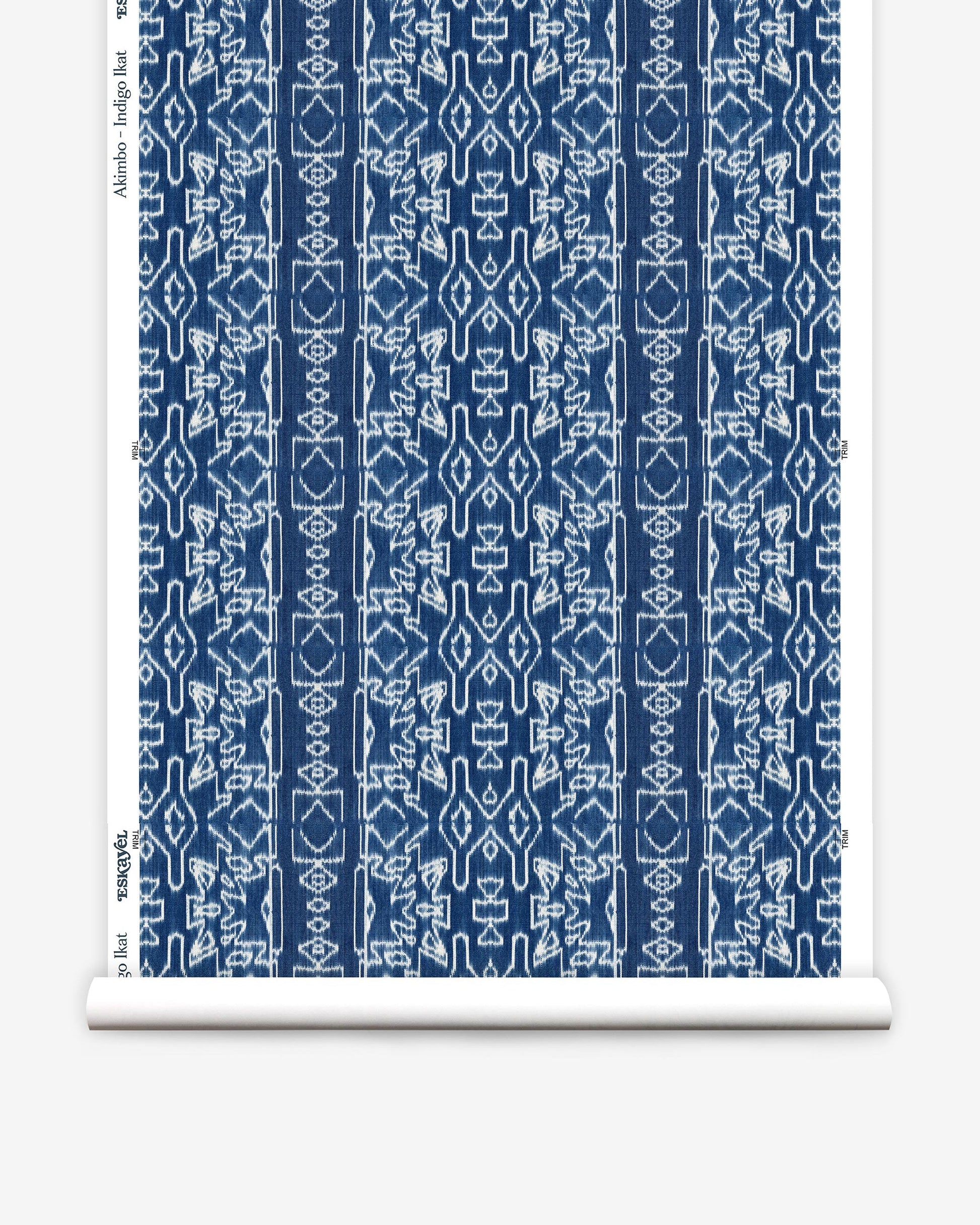 A luxurious roll of Akimbo Wallpaper Indigo Ikat with a blue and white graphic geometric pattern