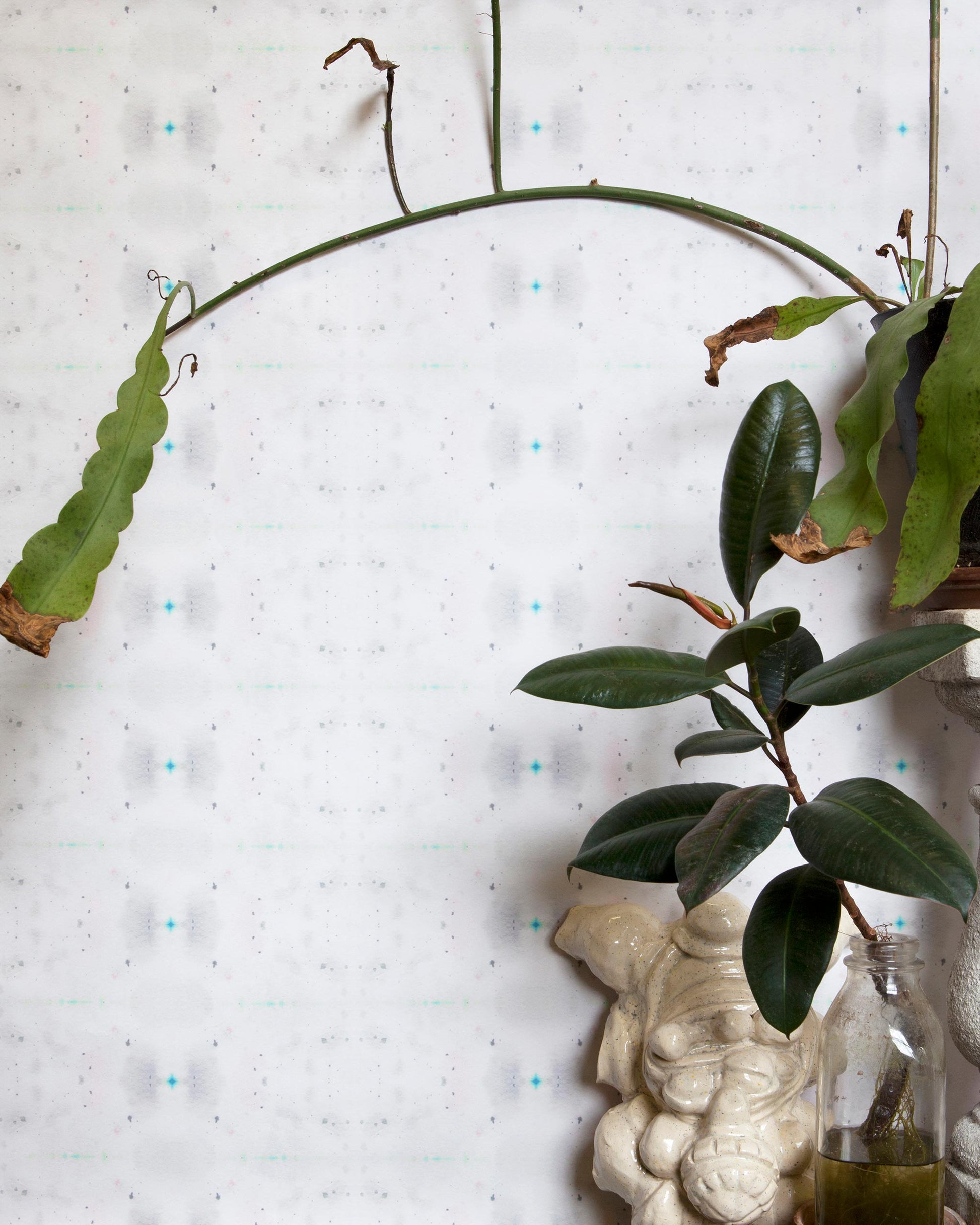 A plant on a vase in the Astral Wallpaper Nyanza Collection