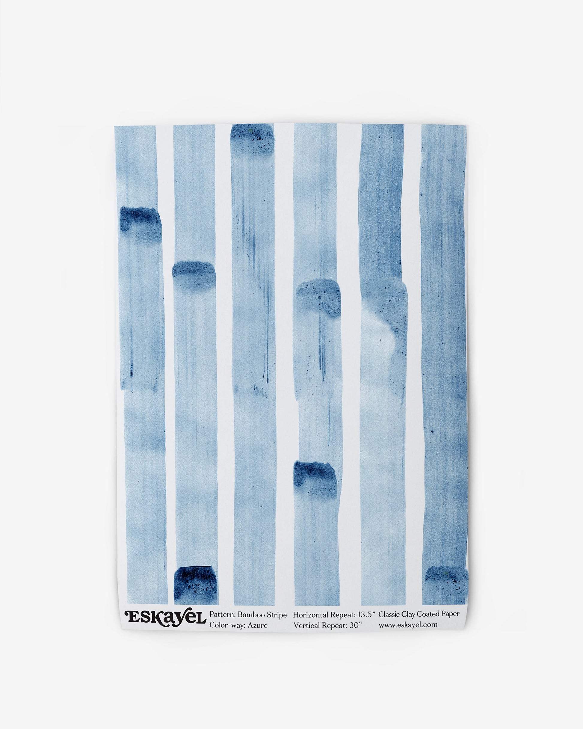 A blue Bamboo Stripe Wallpaper Azure washcloth with blue stripes on it